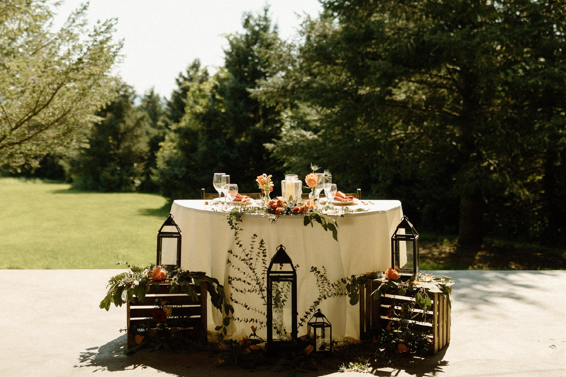 A table with candles and flowers on it