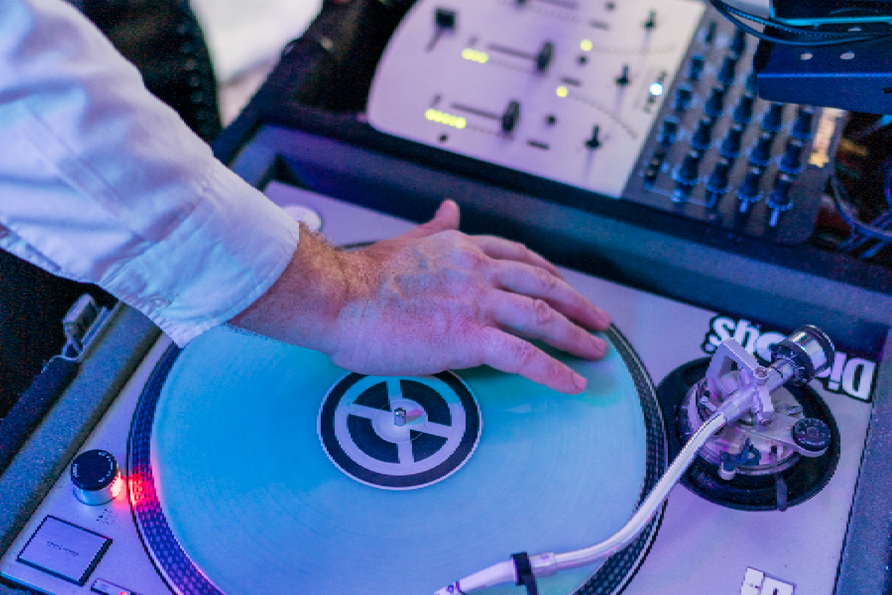 A person is playing on the turntable